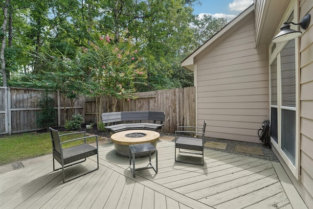 87 E Greenhill Terrace Pl, The Woodlands, TX 77382 - wooden deck featuring an outdoor fire pit