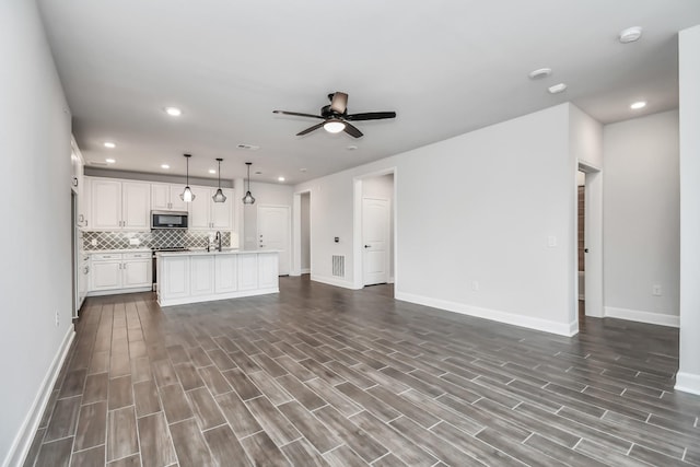 6804 Westview Dr Unit 3405, Houston, TX 77055 - unfurnished living room with dark wood-style floors, ceiling fan, and recessed lighting