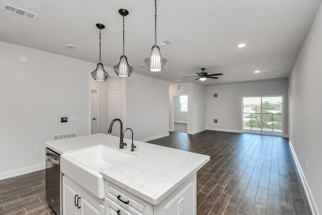 6804 Westview Dr Unit 3405, Houston, TX 77055 - kitchen with dishwasher, dark wood-style floors, ceiling fan, white cabinets, and pendant lighting