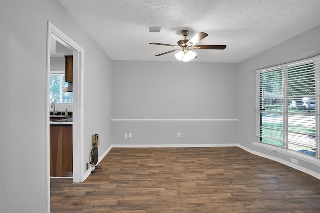 9611 Huntington Hill Dr, Houston, TX 77099 - empty room with a ceiling fan, wood finished floors, and a textured ceiling