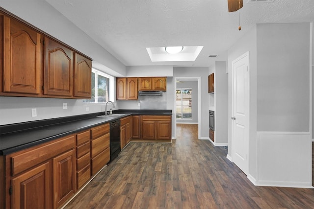 9611 Huntington Hill Dr, Houston, TX 77099 - kitchen featuring dark wood-type flooring, black appliances, dark countertops, brown cabinets, and a textured ceiling