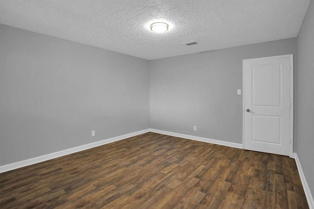 9611 Huntington Hill Dr, Houston, TX 77099 - unfurnished room with dark wood-style floors and a textured ceiling