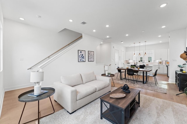 8321 Springwood Creek Ln, Houston, TX 77055 - living area featuring light wood-style flooring and recessed lighting