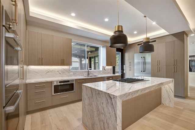 4316 Dickson St, Houston, TX 77007 - kitchen featuring stainless steel appliances, a tray ceiling, modern cabinets, and recessed lighting
