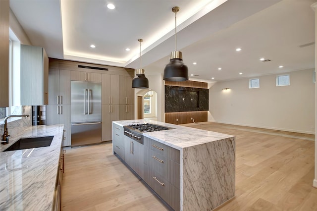4316 Dickson St, Houston, TX 77007 - kitchen with appliances with stainless steel finishes, modern cabinets, gray cabinets, a large island, and light wood finished floors