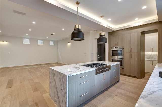 4316 Dickson St, Houston, TX 77007 - kitchen with stainless steel appliances, modern cabinets, light wood-style floors, a kitchen island, and recessed lighting
