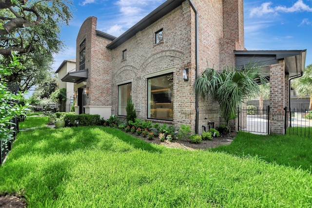 4316 Dickson St, Houston, TX 77007 - view of side of property featuring brick siding and a chimney