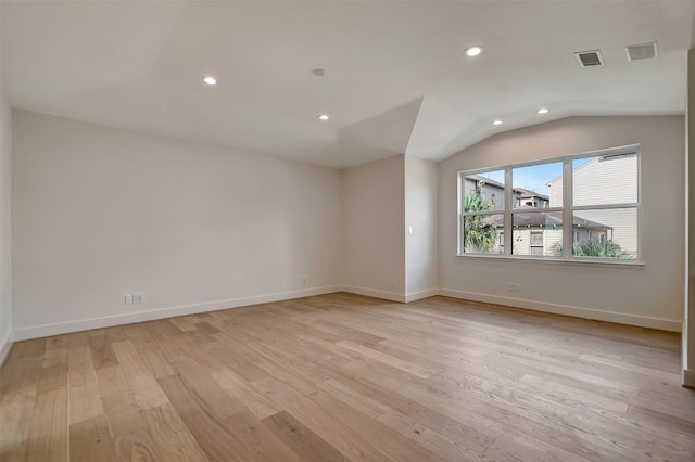 4316 Dickson St, Houston, TX 77007 - spare room featuring light wood-style flooring, recessed lighting, and vaulted ceiling