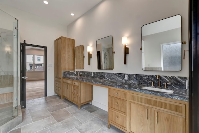 4316 Dickson St, Houston, TX 77007 - bathroom with a marble finish shower, double vanity, stone finish floors, and recessed lighting