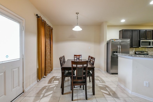4134 Loft Square Pl, Humble, TX 77346 - dining area featuring light tile patterned floors and recessed lighting