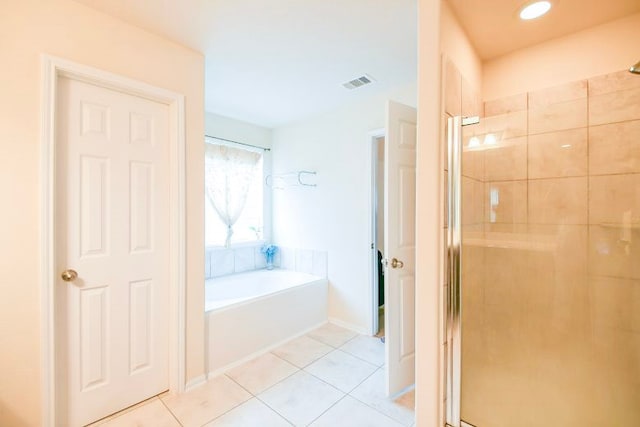 4134 Loft Square Pl, Humble, TX 77346 - bathroom with a shower stall, tile patterned flooring, and a garden tub