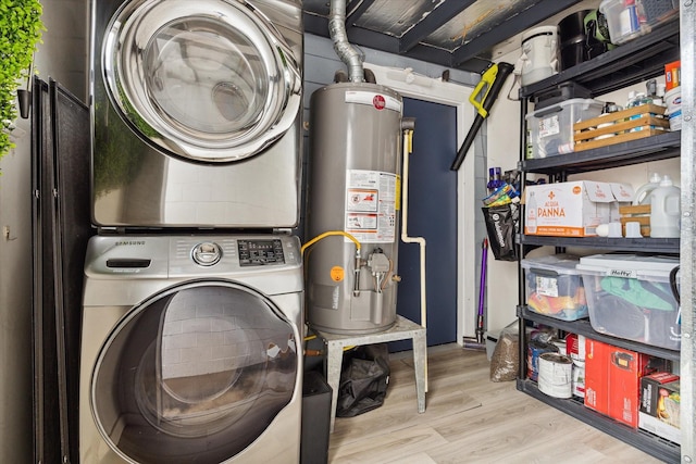 402 E 25th St, Houston, TX 77008 - laundry area with gas water heater, stacked washer and clothes dryer, and wood finished floors