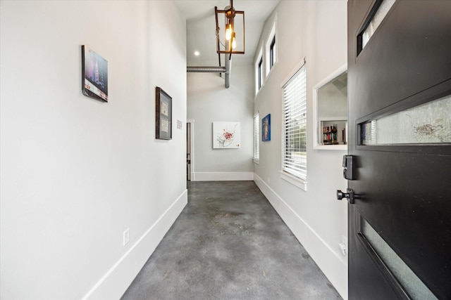 402 E 25th St, Houston, TX 77008 - hall featuring unfinished concrete flooring and a high ceiling