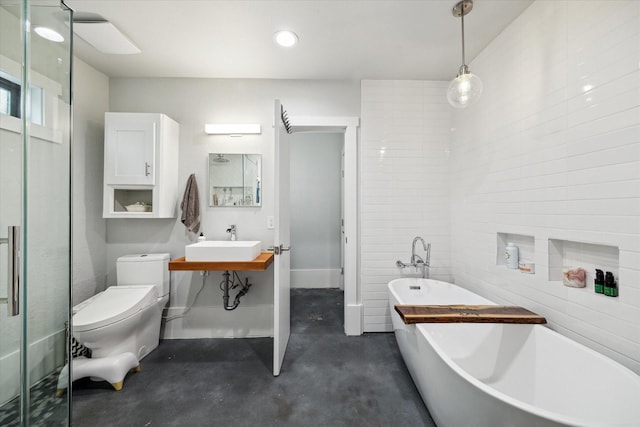 402 E 25th St, Houston, TX 77008 - full bathroom featuring concrete floors, a soaking tub, vanity, recessed lighting, and an enclosed shower
