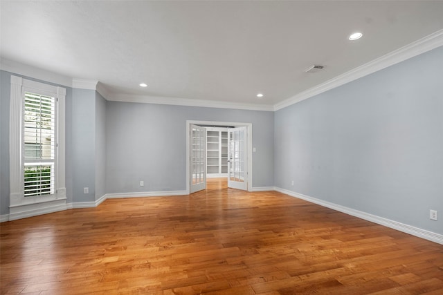 12814 Josey Creek Ct, Cypress, TX 77433 - empty room featuring ornamental molding, light wood-style floors, and recessed lighting