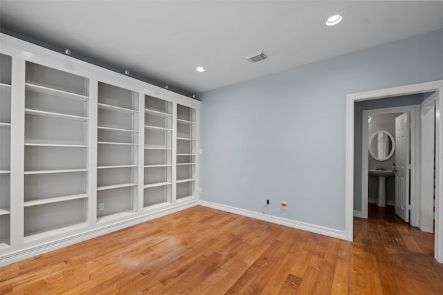 12814 Josey Creek Ct, Cypress, TX 77433 - empty room with wood finished floors and recessed lighting