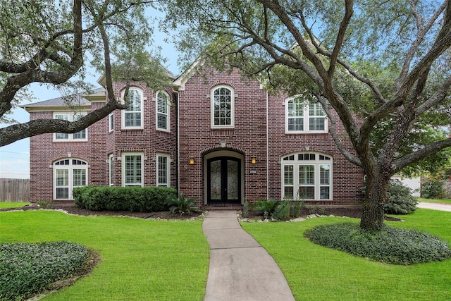12814 Josey Creek Ct, Cypress, TX 77433 - view of front of house featuring french doors, a front lawn, and brick siding