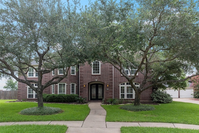 12814 Josey Creek Ct, Cypress, TX 77433 - view of front of property with french doors, brick siding, and driveway