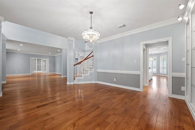 12814 Josey Creek Ct, Cypress, TX 77433 - unfurnished room with ornate columns, a chandelier, wood-type flooring, stairs, and ornamental molding