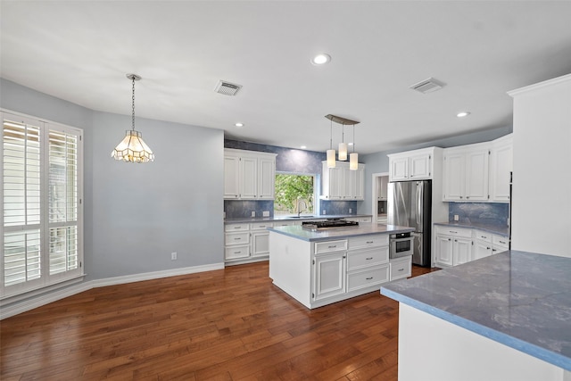 12814 Josey Creek Ct, Cypress, TX 77433 - kitchen with freestanding refrigerator, tasteful backsplash, white cabinets, dark wood finished floors, and recessed lighting