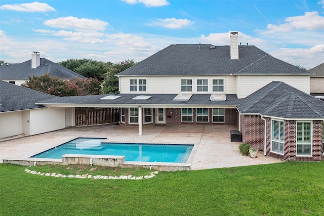 12814 Josey Creek Ct, Cypress, TX 77433 - back of house featuring a patio area, a chimney, brick siding, a yard, and an outdoor pool
