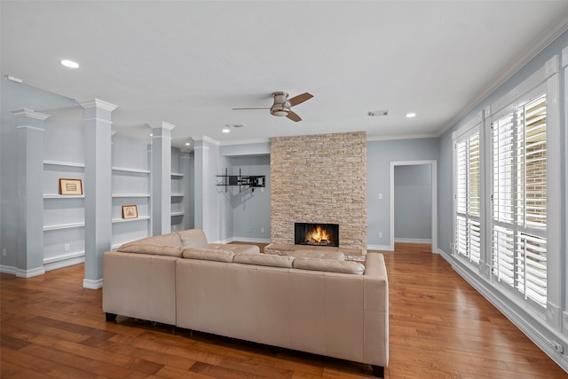 12814 Josey Creek Ct, Cypress, TX 77433 - living room with ceiling fan, ornamental molding, wood finished floors, a fireplace, and recessed lighting