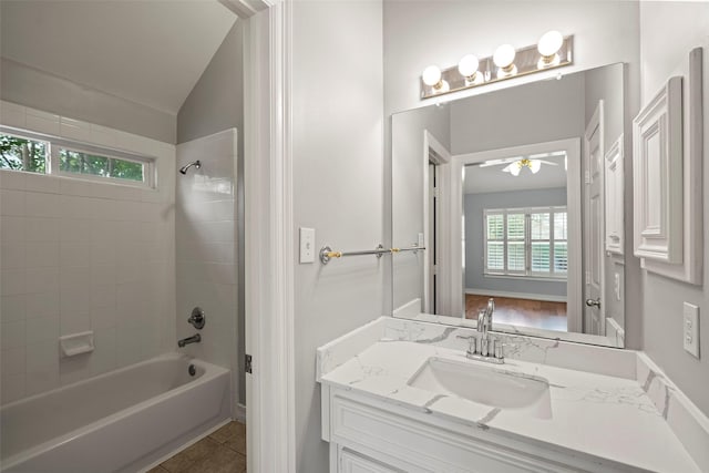 12814 Josey Creek Ct, Cypress, TX 77433 - bathroom with vanity,  shower combination, lofted ceiling, a ceiling fan, and tile patterned flooring