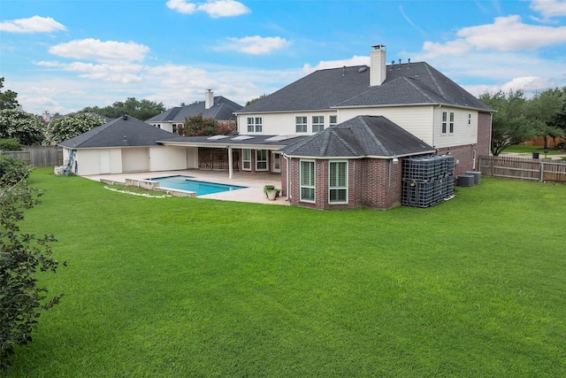 12814 Josey Creek Ct, Cypress, TX 77433 - back of house with brick siding, a fenced backyard, a patio, and a chimney