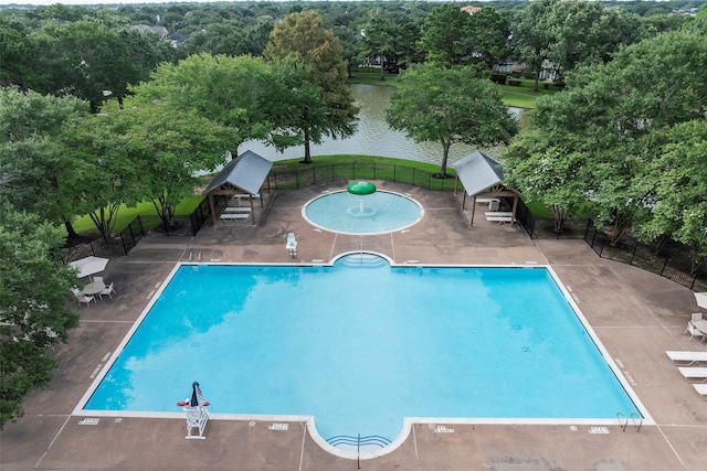 12814 Josey Creek Ct, Cypress, TX 77433 - community pool featuring a patio area, a water view, and view of scattered trees