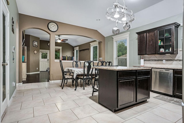 18819 Deer Trace Dr, Crosby, TX 77532 - kitchen featuring dishwasher, arched walkways, vaulted ceiling, ceiling fan, and decorative backsplash