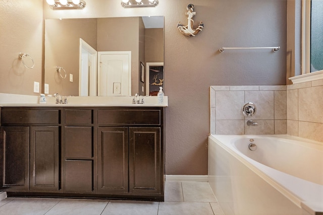 18819 Deer Trace Dr, Crosby, TX 77532 - bathroom featuring a garden tub, tile patterned flooring, double vanity, and a textured wall