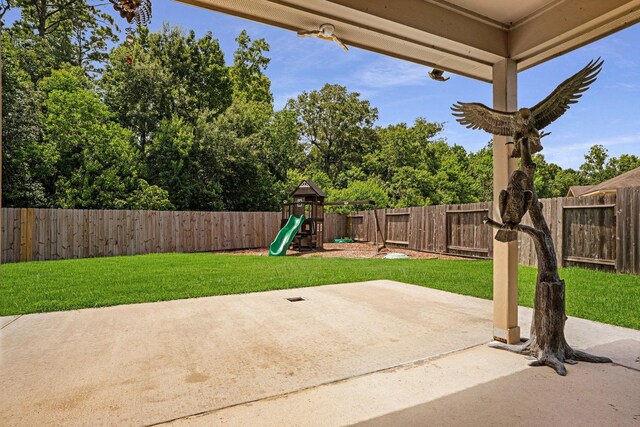 18819 Deer Trace Dr, Crosby, TX 77532 - fenced backyard with a playground and a patio