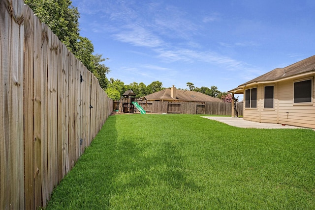 18819 Deer Trace Dr, Crosby, TX 77532 - fenced backyard with a playground and a patio