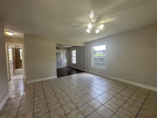 7410 Dallas St, Houston, TX 77011 - unfurnished room featuring light tile patterned floors and a ceiling fan