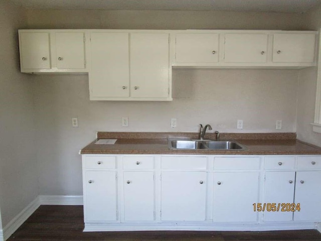 7410 Dallas St, Houston, TX 77011 - kitchen with white cabinets and dark countertops