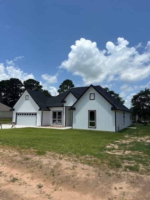 24630 Cavan St, Hempstead, TX 77445 - modern farmhouse style home with a front lawn, board and batten siding, an attached garage, and driveway