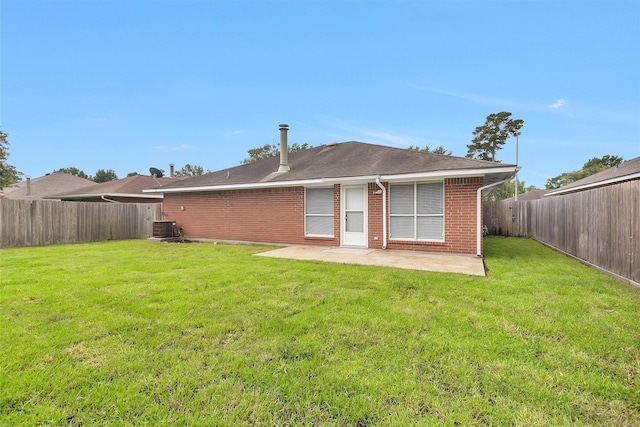 2307 Pine Cone Dr, Houston, TX 77339 - back of property with a patio area, a fenced backyard, and brick siding