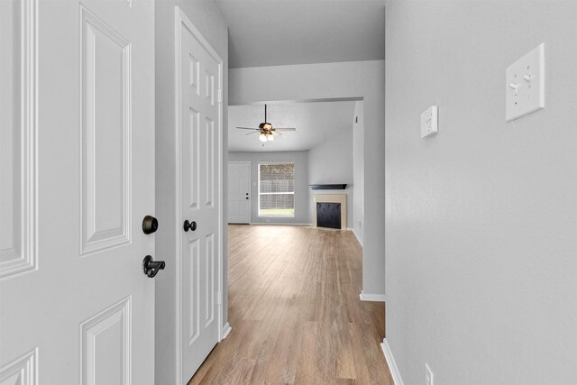2307 Pine Cone Dr, Houston, TX 77339 - hallway with light wood finished floors and baseboards