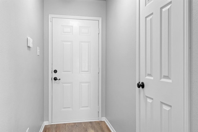 2307 Pine Cone Dr, Houston, TX 77339 - entryway featuring wood finished floors and baseboards