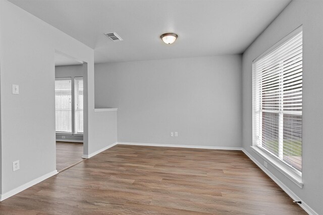 2307 Pine Cone Dr, Houston, TX 77339 - empty room featuring wood finished floors and baseboards