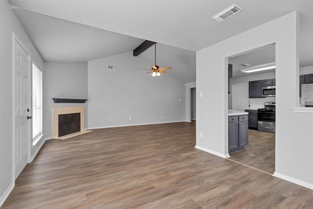 2307 Pine Cone Dr, Houston, TX 77339 - unfurnished living room featuring a premium fireplace, light wood finished floors, and ceiling fan