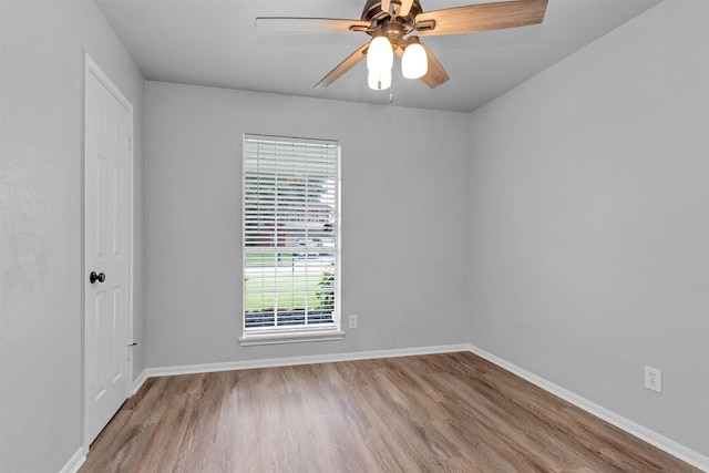 2307 Pine Cone Dr, Houston, TX 77339 - empty room with wood finished floors and ceiling fan