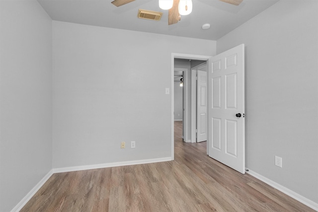 2307 Pine Cone Dr, Houston, TX 77339 - spare room featuring a ceiling fan, wood finished floors, and a smoke detector