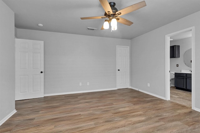 2307 Pine Cone Dr, Houston, TX 77339 - empty room featuring a ceiling fan and light wood-style floors