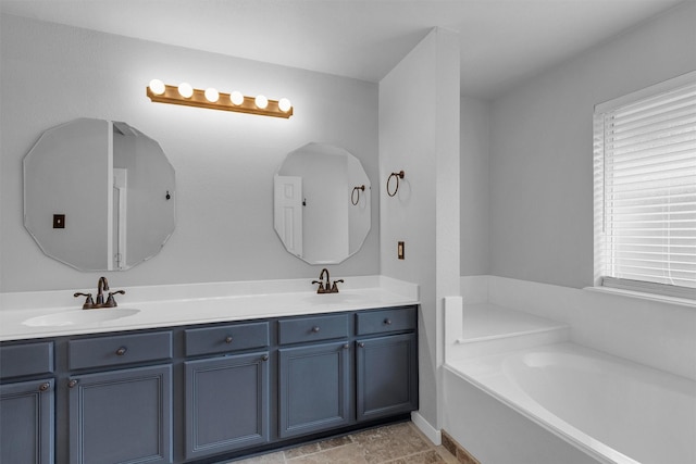 2307 Pine Cone Dr, Houston, TX 77339 - full bath featuring double vanity, a bath, and plenty of natural light