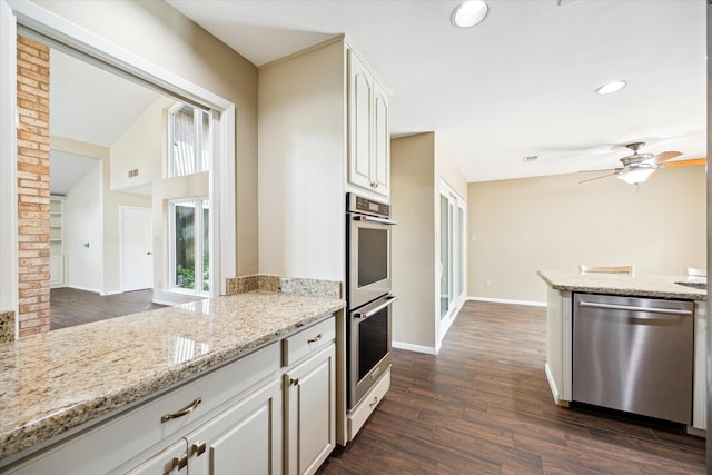 3002 Durban Dr, Houston, TX 77043 - kitchen with stainless steel appliances, dark wood-style flooring, light stone countertops, ceiling fan, and recessed lighting