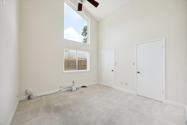 3002 Durban Dr, Houston, TX 77043 - carpeted empty room with high vaulted ceiling and ceiling fan