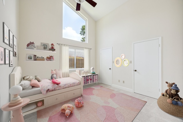 3002 Durban Dr, Houston, TX 77043 - carpeted bedroom with high vaulted ceiling and ceiling fan