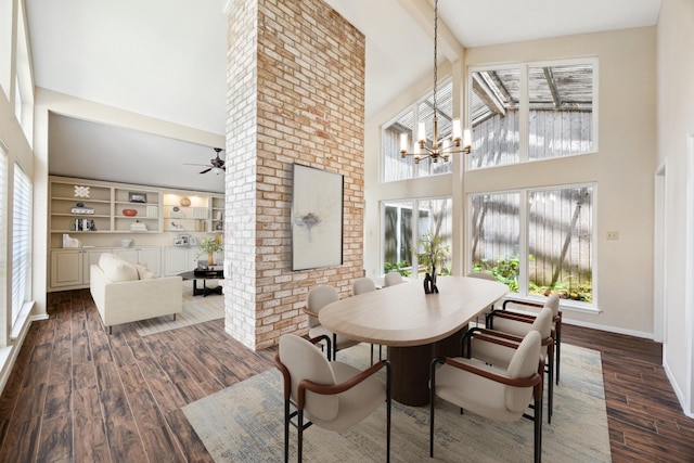 3002 Durban Dr, Houston, TX 77043 - dining area with a high ceiling, dark wood-style flooring, a chandelier, and ceiling fan