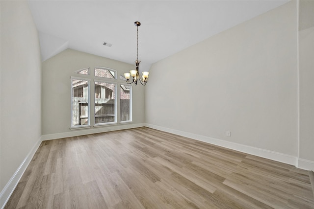 23414 Fauburg Dr, New Caney, TX 77357 - empty room with a chandelier, light wood-style floors, and lofted ceiling